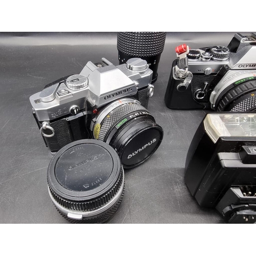 1689 - Cameras: an Olympus OM-2n, with 28-48mm 1:4 lens; together with an Olympus OM30, with 1:1.8 f=50mm l... 