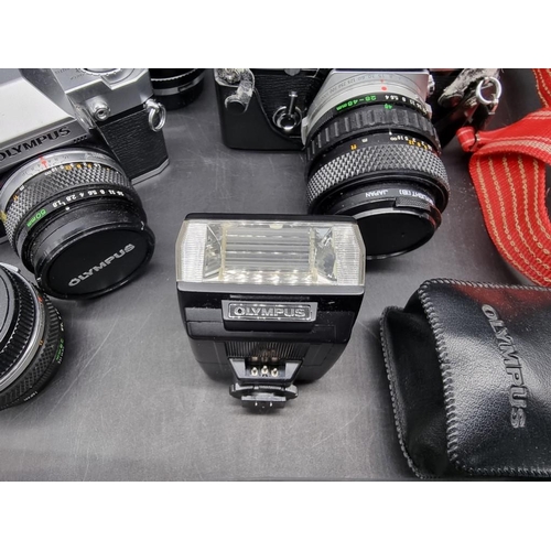 1689 - Cameras: an Olympus OM-2n, with 28-48mm 1:4 lens; together with an Olympus OM30, with 1:1.8 f=50mm l... 