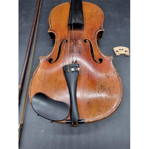 1691 - An interesting antique continental violin, with 14in two piece back, with bow and case. ... 