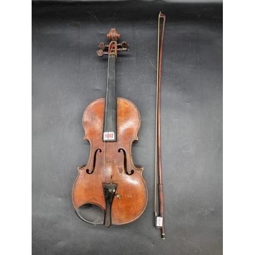 1692 - An antique continental violin, with 14in one piece back, (s.d); together with a bow and case.&n... 