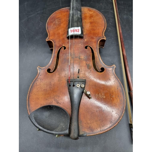 1692 - An antique continental violin, with 14in one piece back, (s.d); together with a bow and case.&n... 