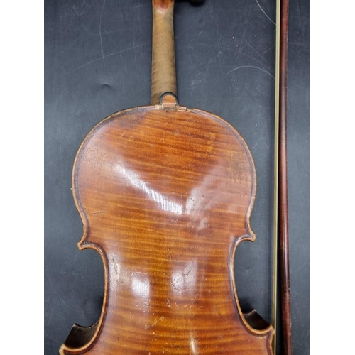 1692 - An antique continental violin, with 14in one piece back, (s.d); together with a bow and case.&n... 