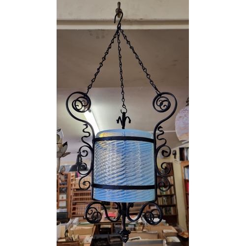 1699 - A wrought iron and blue vaseline glass ceiling shade or lantern, the glass 18 x 18cm. ... 