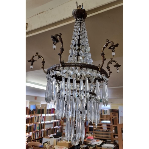 1701 - An antique brass and facetted glass chandelier, approx 54cm high, (losses).