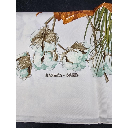 1718 - Hermes: a white ground 'Turbans Des Reines' pattern silk scarf, in original box.