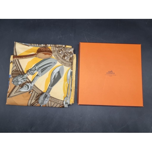 1719 - Hermes: a yellow ground 'Culliers d'Afrique' pattern silk scarf, in original box.