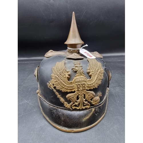 1725 - A German World War I pickelhaube, with Prussian Eagle mount to front, (lacking liner).... 