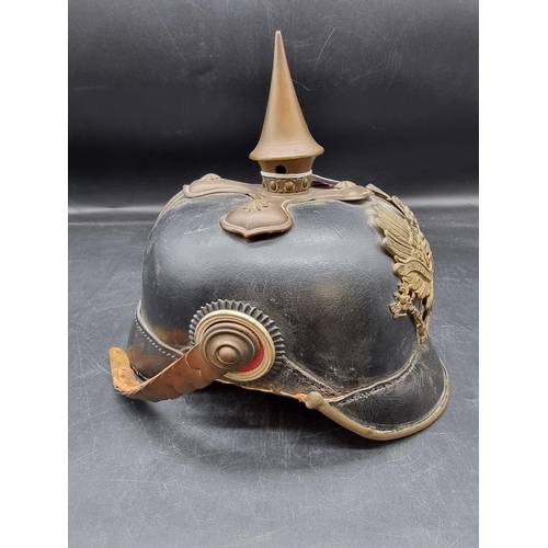 1725 - A German World War I pickelhaube, with Prussian Eagle mount to front, (lacking liner).... 