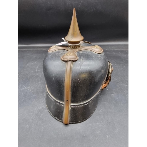 1725 - A German World War I pickelhaube, with Prussian Eagle mount to front, (lacking liner).... 