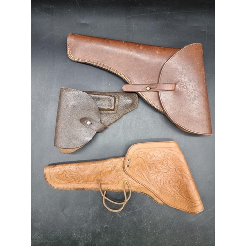 1726 - Three leather gun holsters.