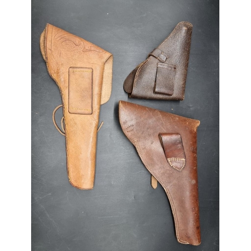 1726 - Three leather gun holsters.