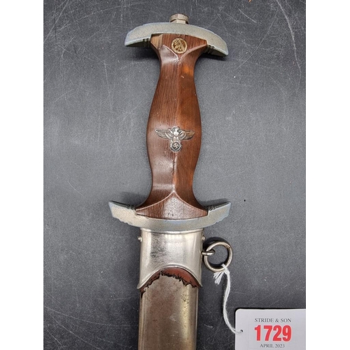 1729 - A German Third Reich SA dagger and sheath, the engraved 22cm blade stamped 'RZM M7/33 1940'.... 