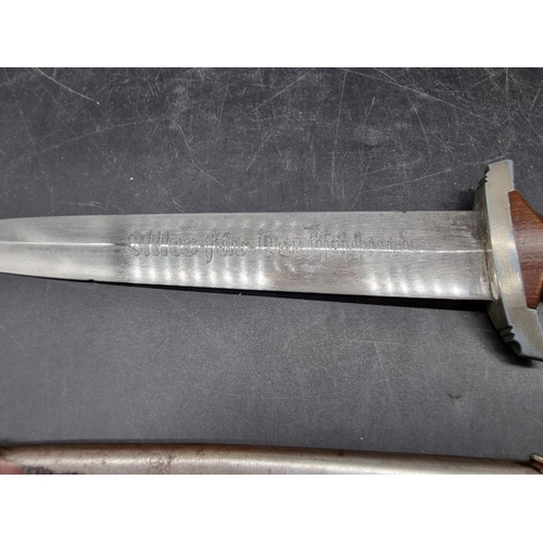 1729 - A German Third Reich SA dagger and sheath, the engraved 22cm blade stamped 'RZM M7/33 1940'.... 