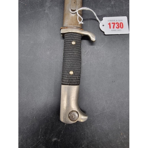 1730 - A German World War II dress bayonet and sheath, the 18cm blade stamped ACS for Alcoso Solingen.... 