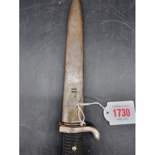 1730 - A German World War II dress bayonet and sheath, the 18cm blade stamped ACS for Alcoso Solingen.... 