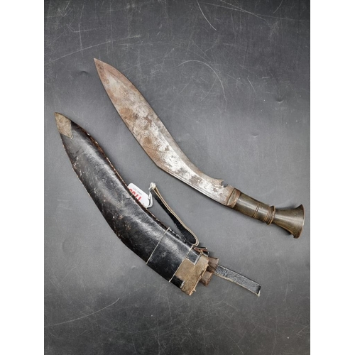 1756 - A Nepalese kukri and leather sheath, with 30cm blade.