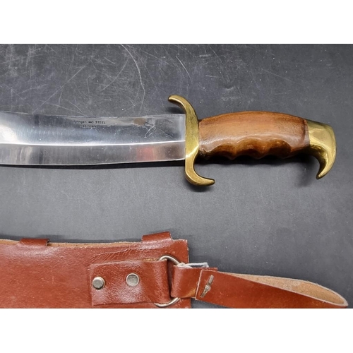 1758 - A large Pakistan Bowie and leather sheath, with 33cm blade.