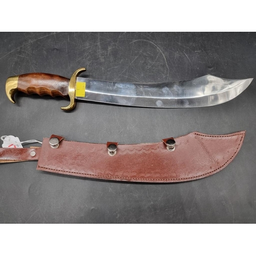 1758 - A large Pakistan Bowie and leather sheath, with 33cm blade.