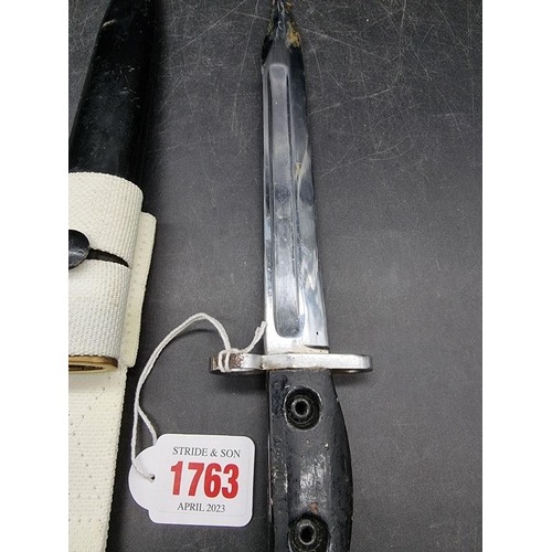 1763 - A scarce British L2A1 Sterling machine carbine bayonet and steel scabbard, with 20cm blade and white... 