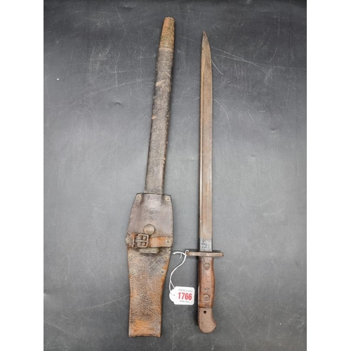 1766 - A British World War I pattern 1907 Lee Enfield sword bayonet and leather scabbard, stamped Wilkinson... 