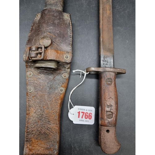 1766 - A British World War I pattern 1907 Lee Enfield sword bayonet and leather scabbard, stamped Wilkinson... 