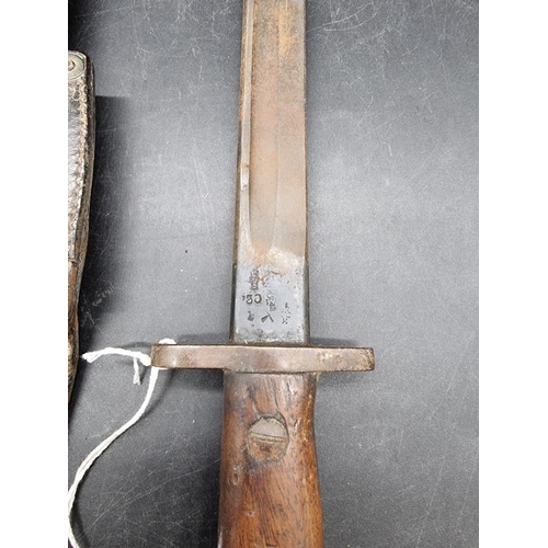 1766 - A British World War I pattern 1907 Lee Enfield sword bayonet and leather scabbard, stamped Wilkinson... 