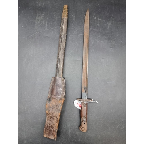 1766 - A British World War I pattern 1907 Lee Enfield sword bayonet and leather scabbard, stamped Wilkinson... 