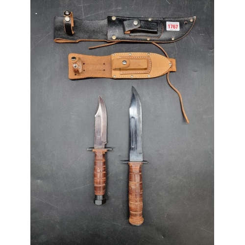 1767 - Two Bowie knives and leather sheaths, the blades 17.5cm and 12.5cm respectively.... 