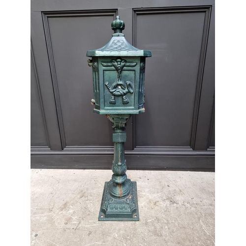 1780 - A green painted cast iron pedestal post box, 107cm high.