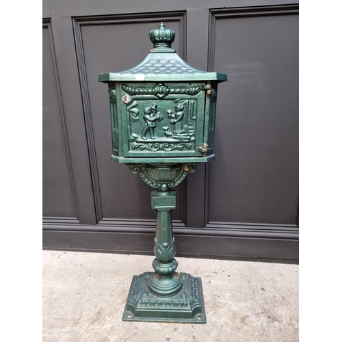 1780 - A green painted cast iron pedestal post box, 107cm high.