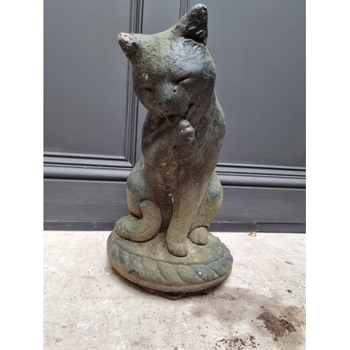 1785 - A black painted composition stone cat, 41cm high.