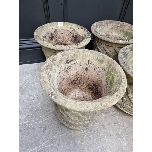 1787 - A set of four composition stone garden planters, 34cm high.