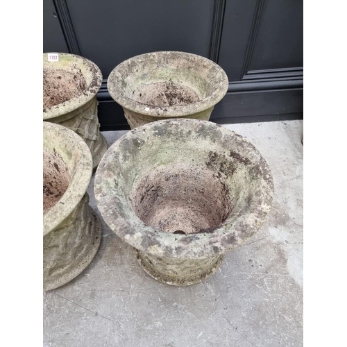 1787 - A set of four composition stone garden planters, 34cm high.