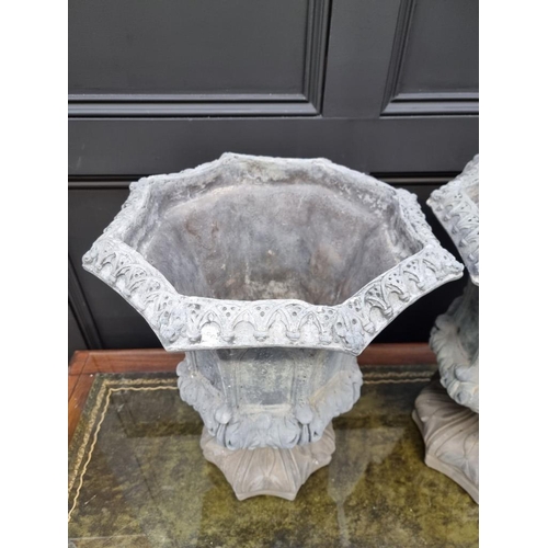 1788 - An unusual pair of composition stone simulated lead octagonal pedestal urns, 50cm high.... 