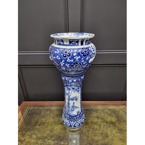 1795 - A Japanese blue and white jardiniere and pedestal, 72cm high, (repairs to jardiniere).... 