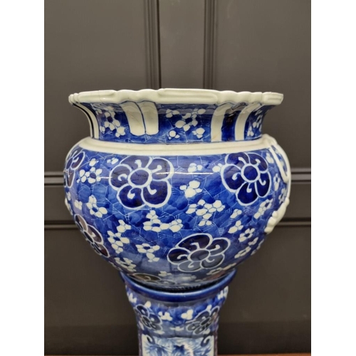 1795 - A Japanese blue and white jardiniere and pedestal, 72cm high, (repairs to jardiniere).... 