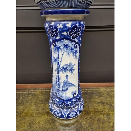 1795 - A Japanese blue and white jardiniere and pedestal, 72cm high, (repairs to jardiniere).... 