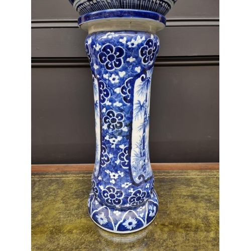 1795 - A Japanese blue and white jardiniere and pedestal, 72cm high, (repairs to jardiniere).... 