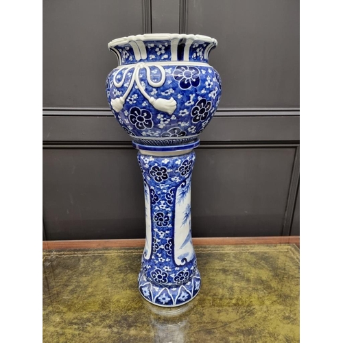 1795 - A Japanese blue and white jardiniere and pedestal, 72cm high, (repairs to jardiniere).... 