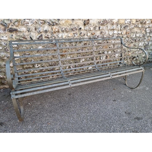 1818 - A green painted wrought iron park bench, having scroll ends, 178cm wide x 79cm high.... 