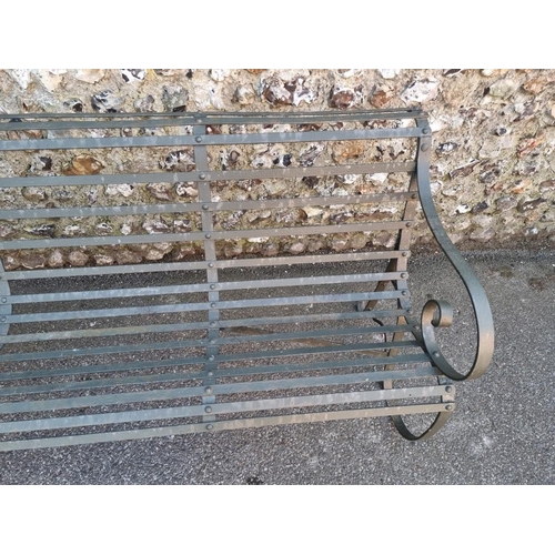 1818 - A green painted wrought iron park bench, having scroll ends, 178cm wide x 79cm high.... 