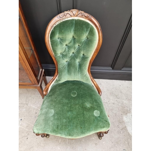 1819 - A Victorian walnut and green upholstered occasional chair; together with an Edwardian display cabine... 