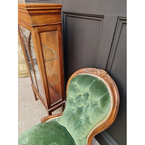 1819 - A Victorian walnut and green upholstered occasional chair; together with an Edwardian display cabine... 