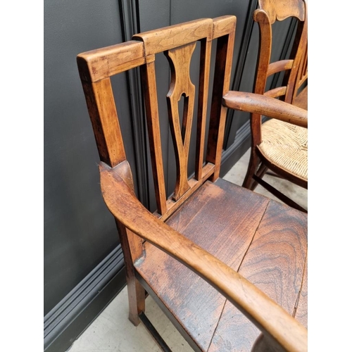 1823 - A pair of early 19th century elm dining chairs; together with another elm elbow chair; and another r... 