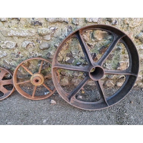 1824 - Five old iron wheels, largest, 60cm wide.