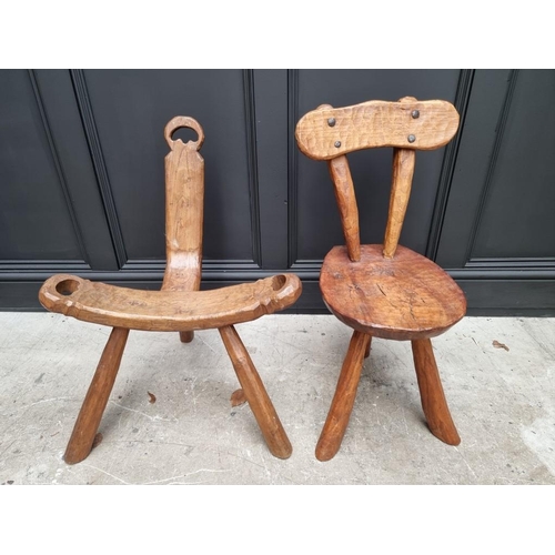 1827 - An elm birthing stool; together with another rustic elm three legged stool. (2)