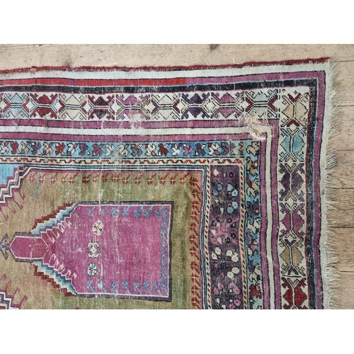 1015 - A Persian rug, having temple design to central field, with floral and geometric borders, 173 x 115cm... 