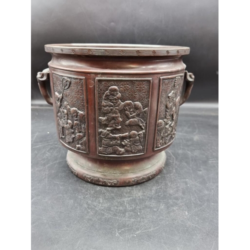 1798 - A Japanese bronze twin handled jardiniere, Meiji, 24cm high. 