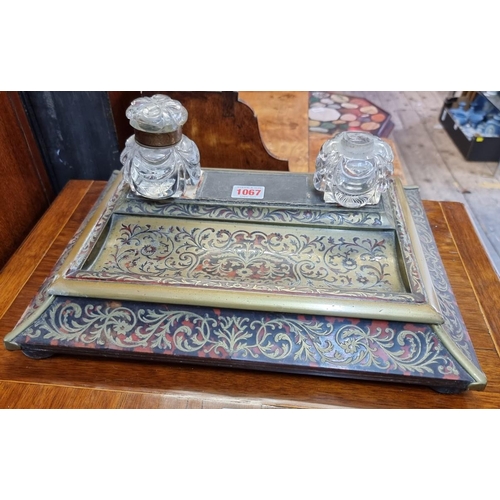 1067 - A 19th century tortoiseshell and brass Boulle desk stand, 37cm wide, (s.d.).