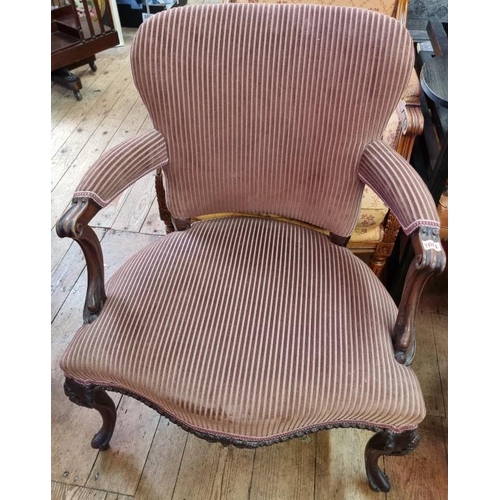 1081 - A George III carved mahogany and upholstered fauteuil.  